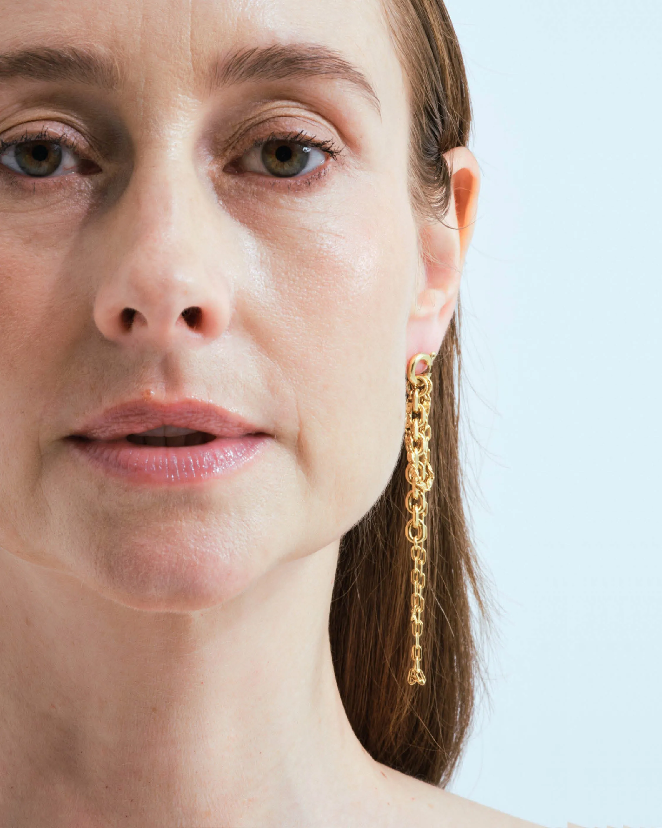 Stud earrings with spring ring and falling chains
